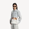 Damen-Le-City-Tasche, klein, mit riesigen Nieten und Strasssteinen in Optikweiss Damen-Le-City-Tasche, klein, mit riesigen Nieten und Strasssteinen in Optikweiss