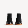 Herren-Sneaker «Speed 2.0» mit vollständig transparenter Sohle aus recyceltem Strick in Schwarz/Orange Herren-Sneaker «Speed 2.0» mit vollständig transparenter Sohle aus recyceltem Strick in Schwarz/Orange